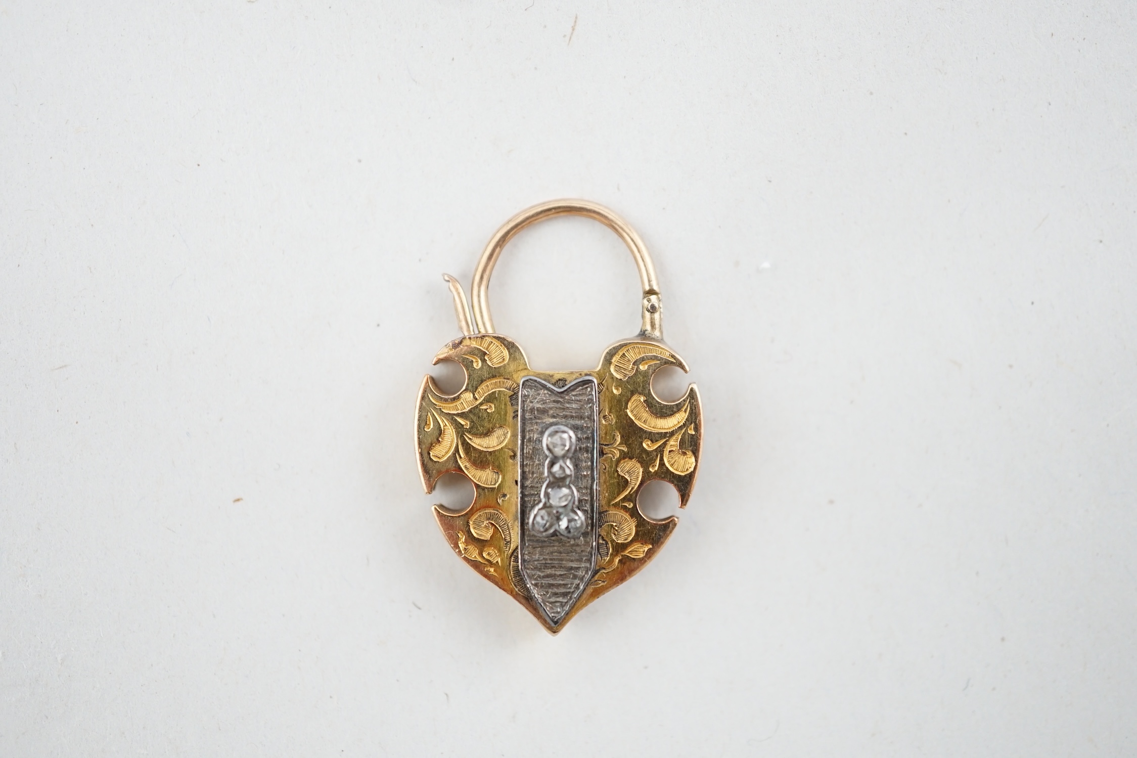 A Victorian engraved gold, carnelian and five stone rose cut diamond set padlock pendant